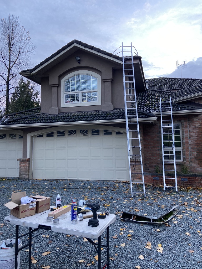 Ladders and tools prepared for residential gutter installation