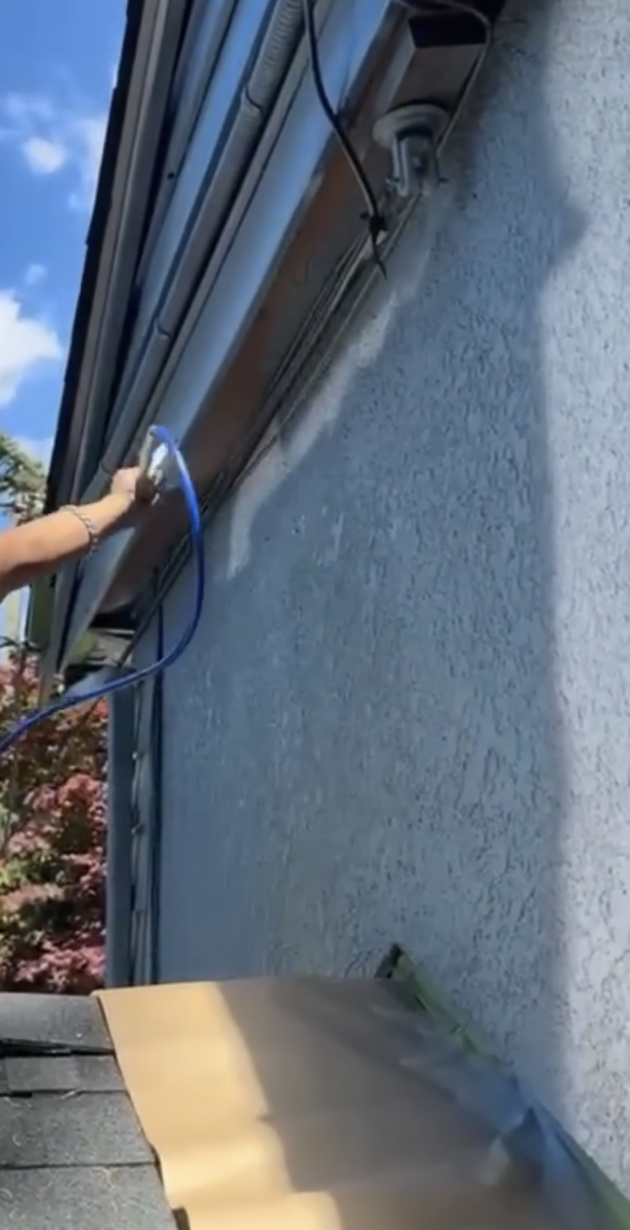 Spray preparation along exterior eaves and wall surface