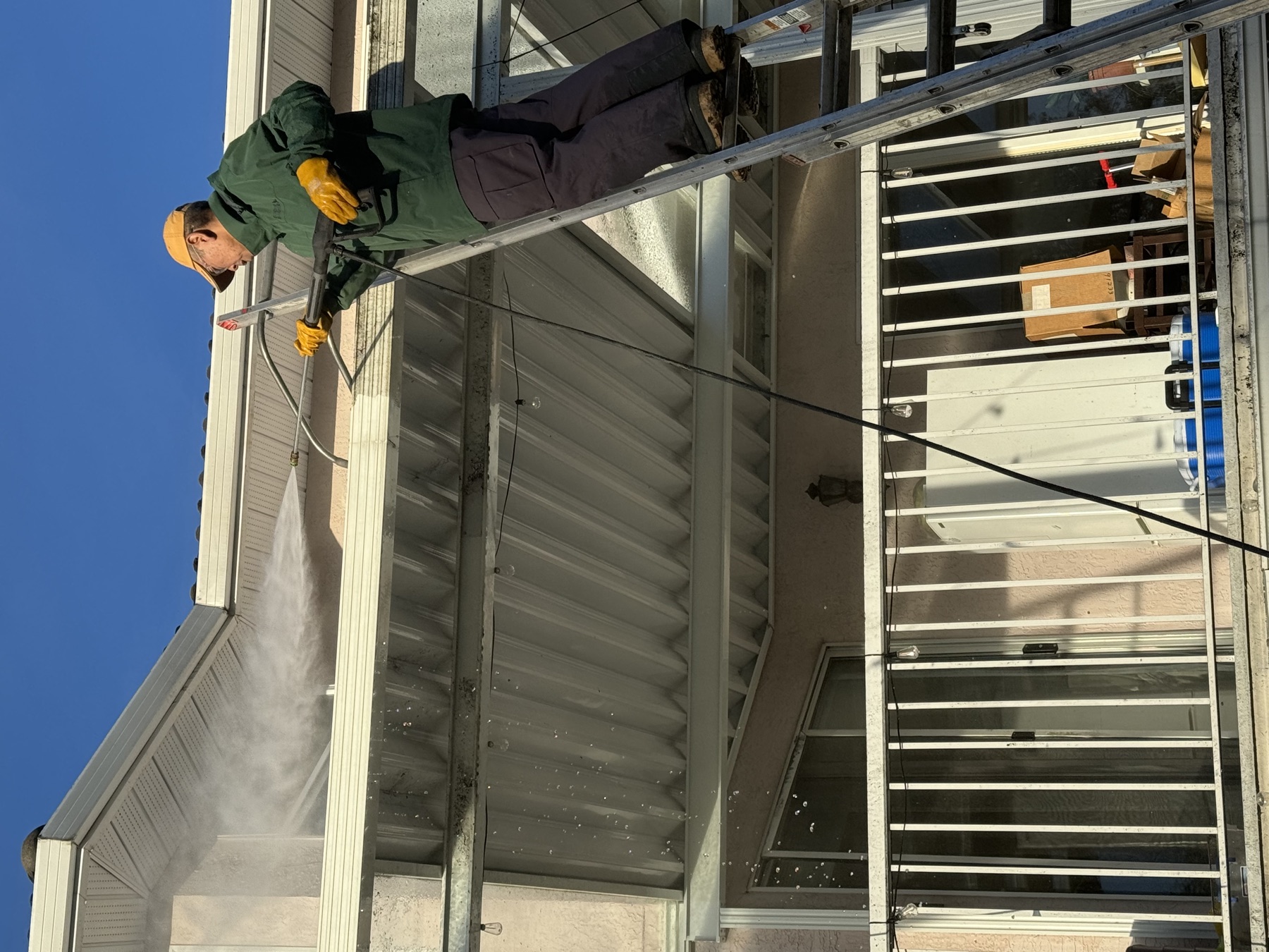 Pressure washing soffit and fascia area