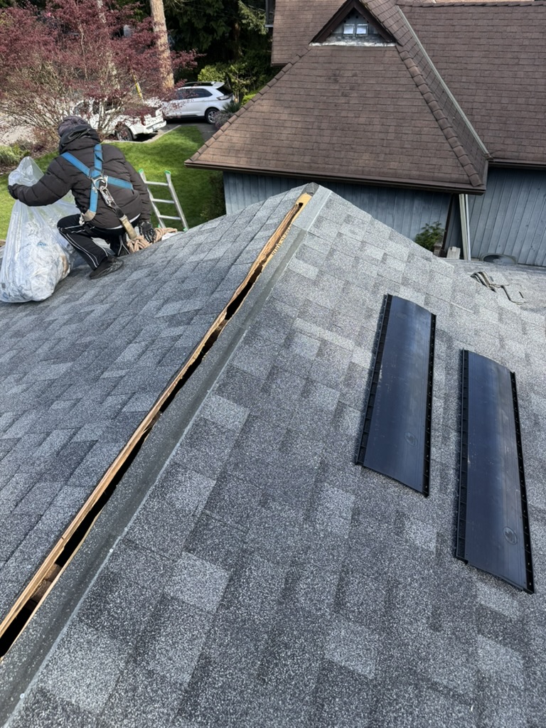 Roofing installation work around ridge ventilation
