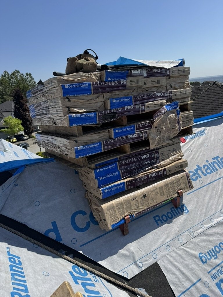 Roofing materials staged for a roof installation project