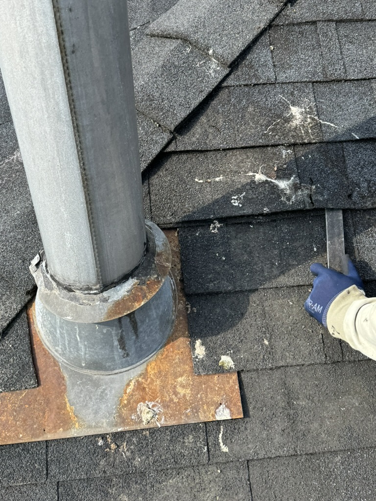 Metal vent flashing detail during roof repair