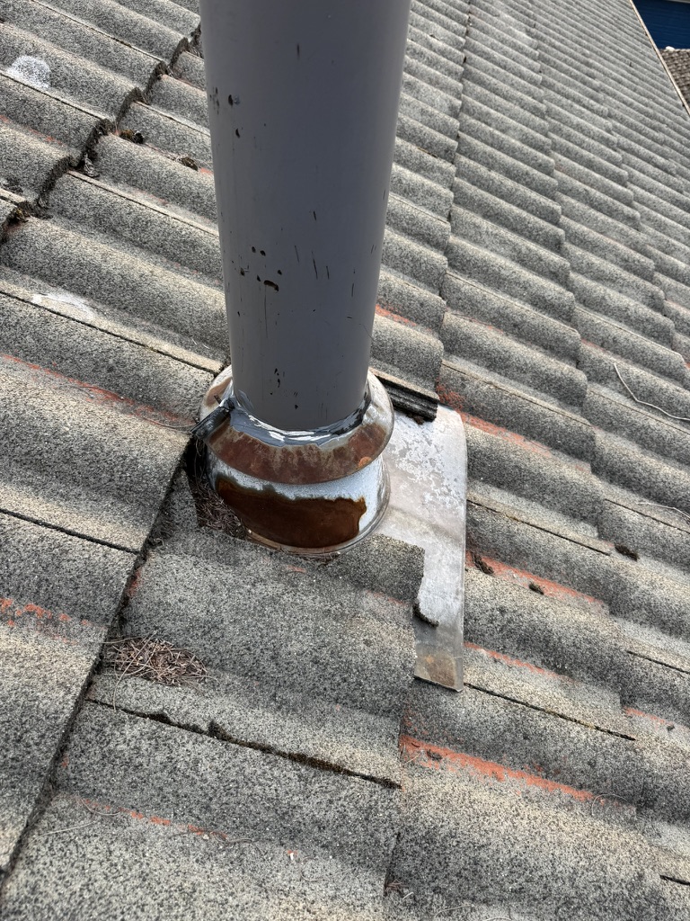 Pipe boot flashing roof repair in progress