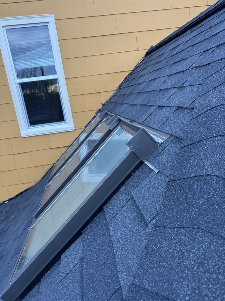 Skylight flashing and shingle transition detail