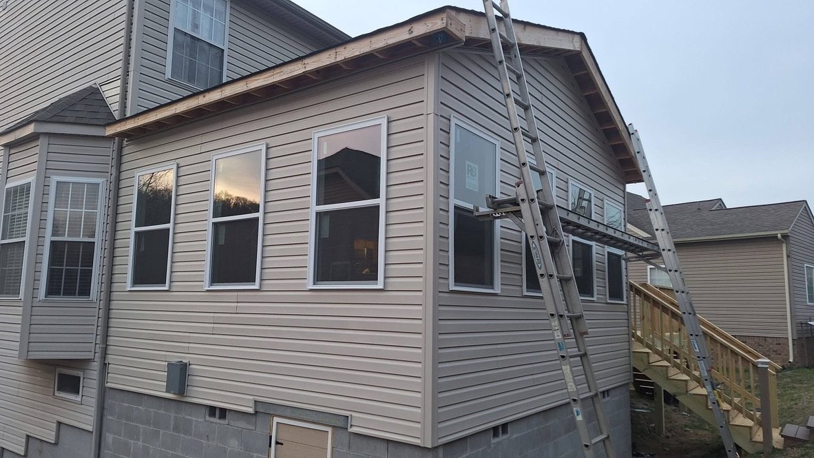 Finished beige siding rear addition