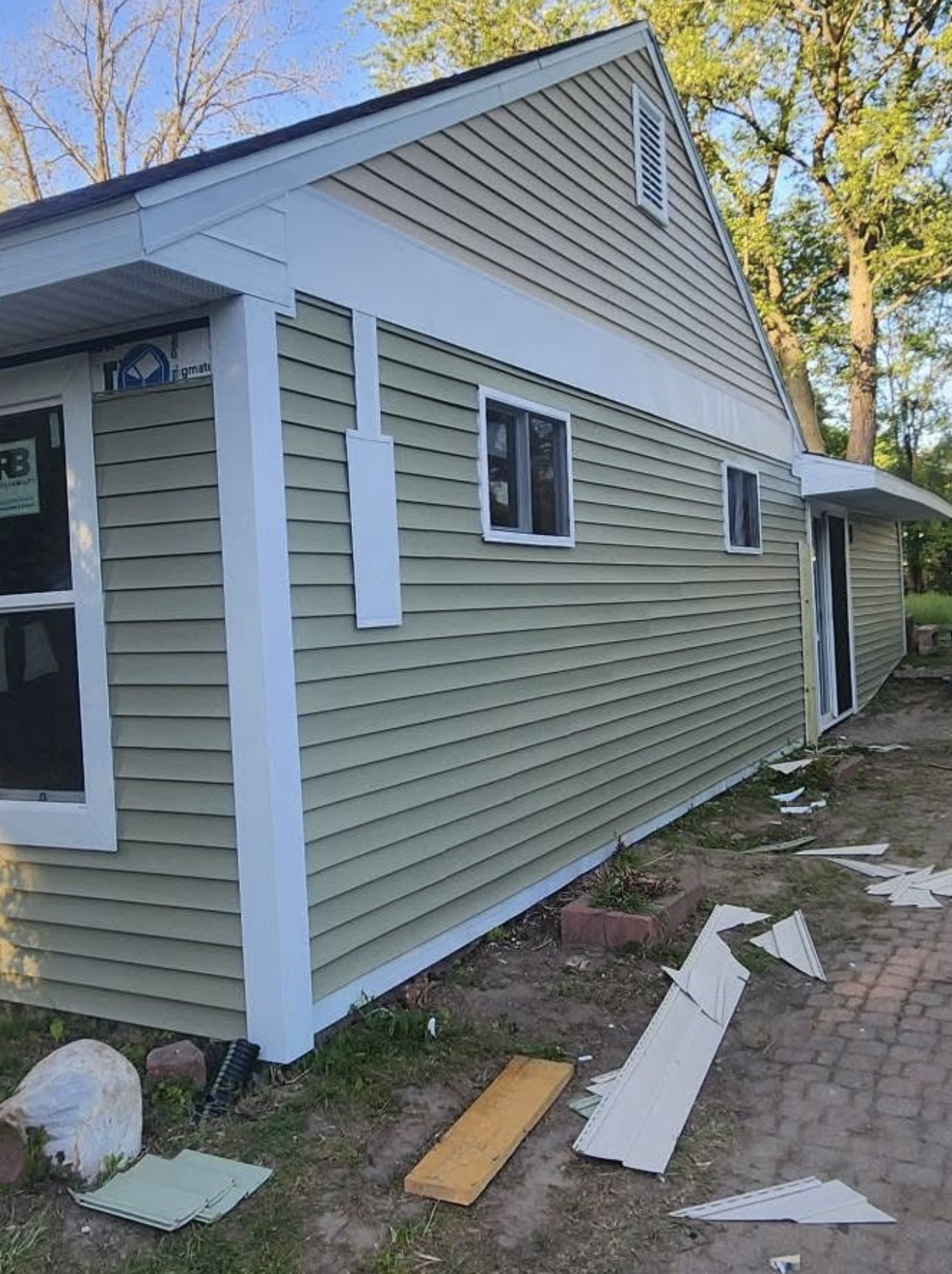 Finished exterior with fresh siding colour and white trim