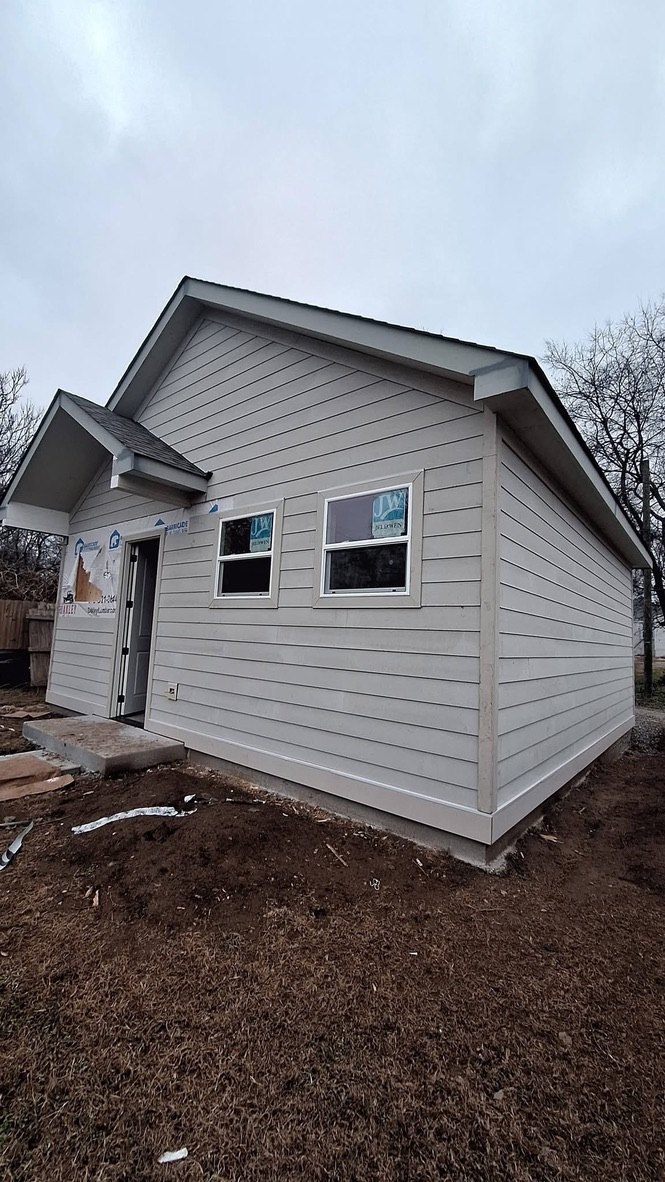 Finished light siding with trim details