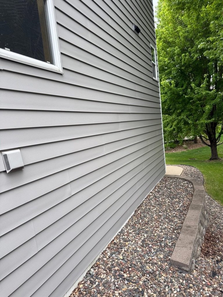 Grey vinyl siding wall detail for siding repair
