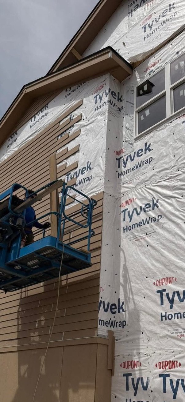 Siding installation over Tyvek housewrap using lift access