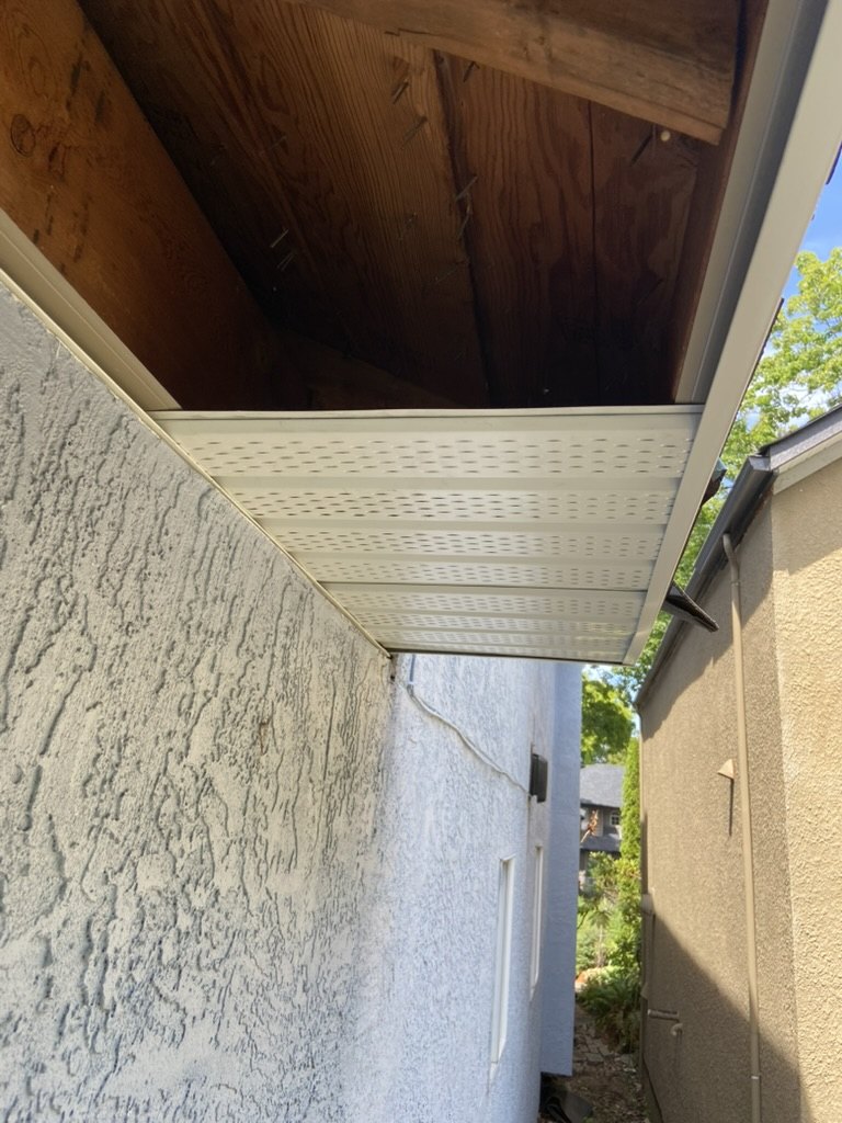 Partial soffit installation with exposed wood framing